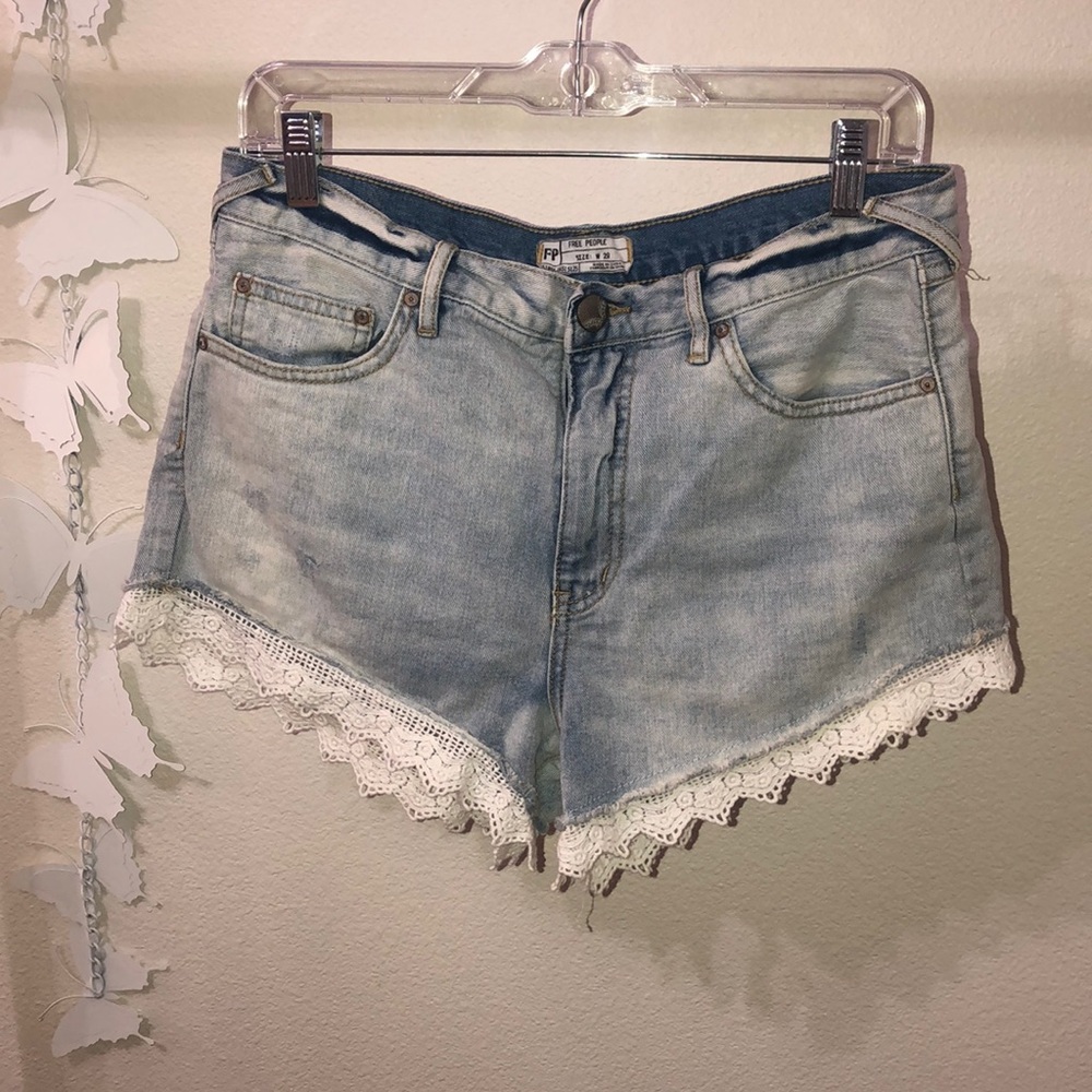 Free People brand Jean shorts with lace trim. Size 29